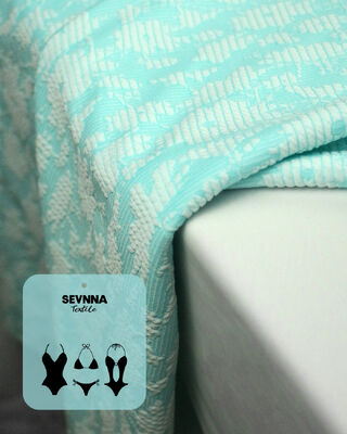 Премиальная текстурированная ткань для купальников шириной 135 см, плотностью 195 г/м² и составом 50% переработанного полиэстера